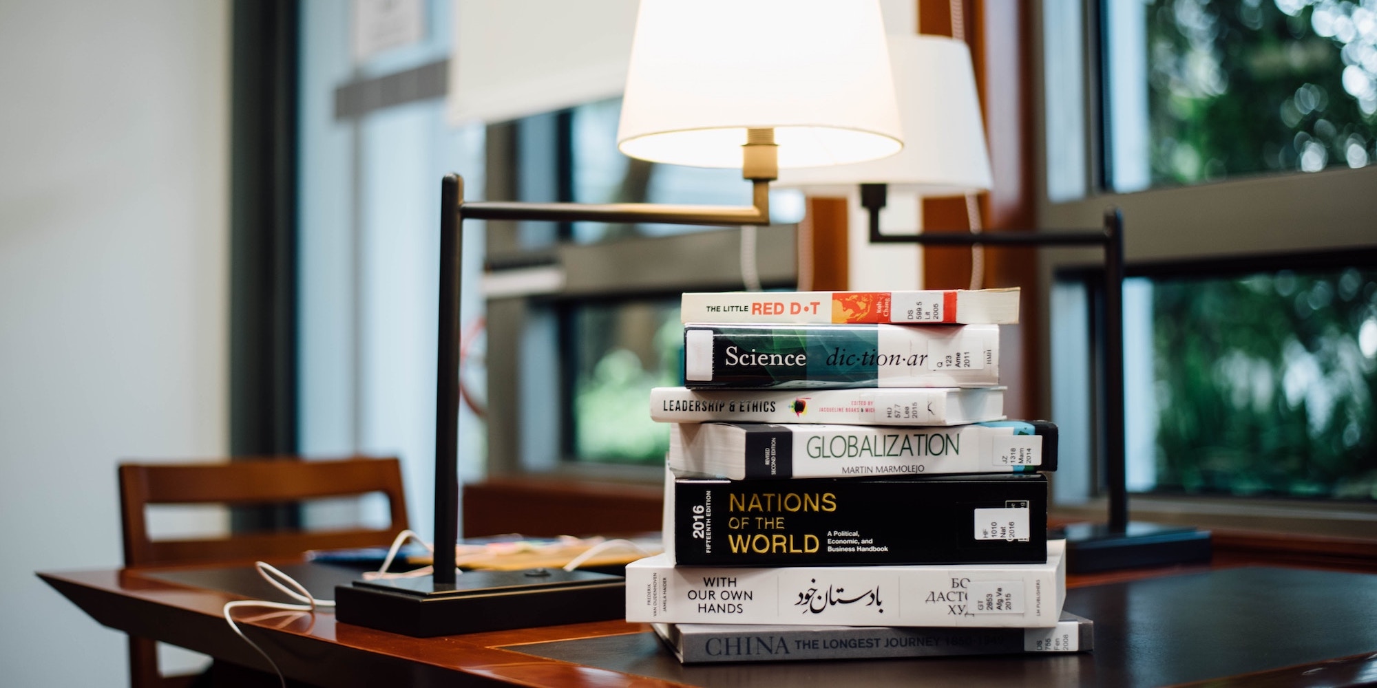 Stack of books on table.